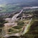 A verdant and hilly landscape with remote roadways and houses in Oslo, Norway